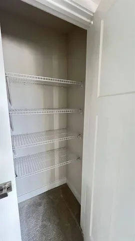 a view of an empty walk in closet