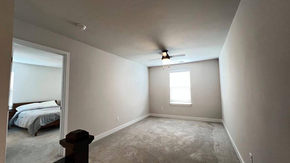 136 Salt Lk Lane Hoschton, GA 30548 - Photo 9 of 22 a view of a livingroom with a window