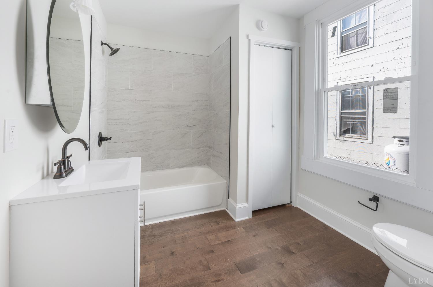 2927 Langhorne Road Lynchburg, VA 24501 - Photo 11 of 48 a bathroom with a tub sink and mirror