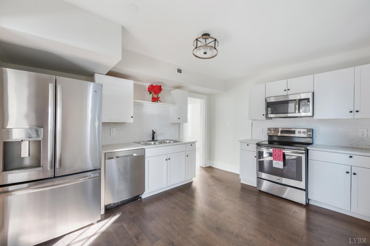 2927 Langhorne Road Lynchburg, VA 24501 - Photo 14 of 48 a kitchen with stainless steel appliances granite countertop a refrigerator sink and stove