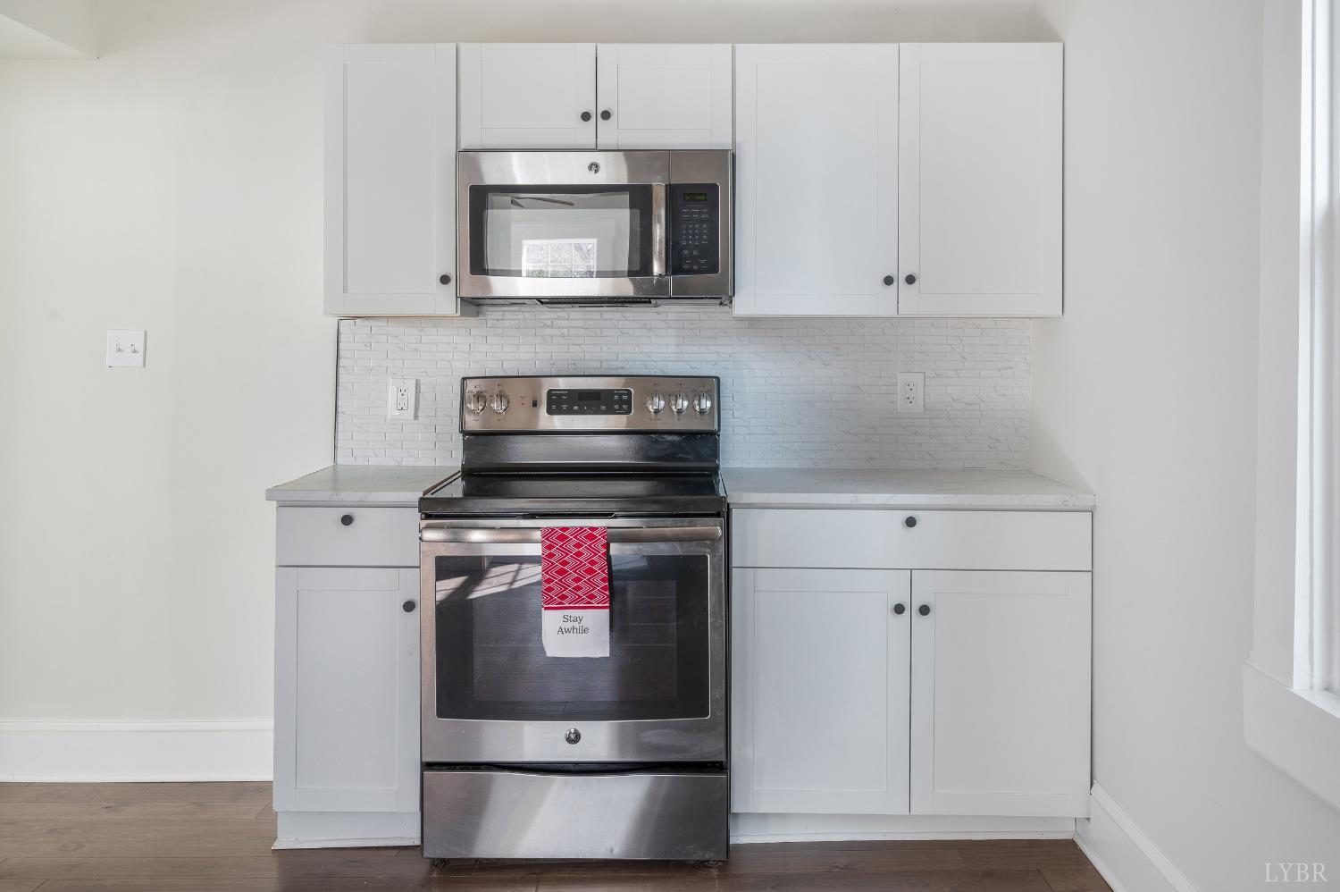 2927 Langhorne Road Lynchburg, VA 24501 - Photo 16 of 48 a kitchen with stainless steel appliances granite countertop a stove and a microwave