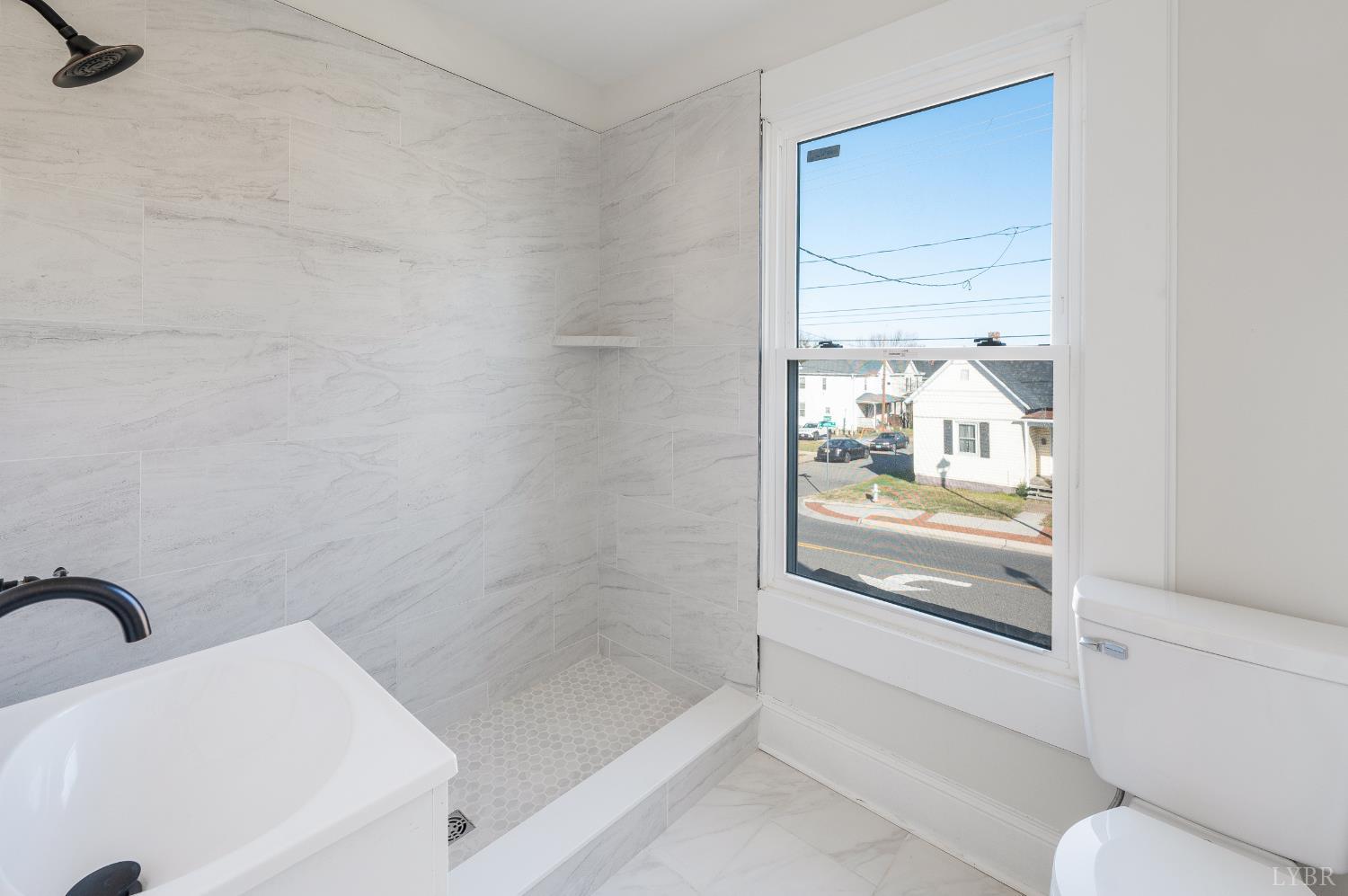 2927 Langhorne Road Lynchburg, VA 24501 - Photo 24 of 48 a bathroom with a bathtub and a shower