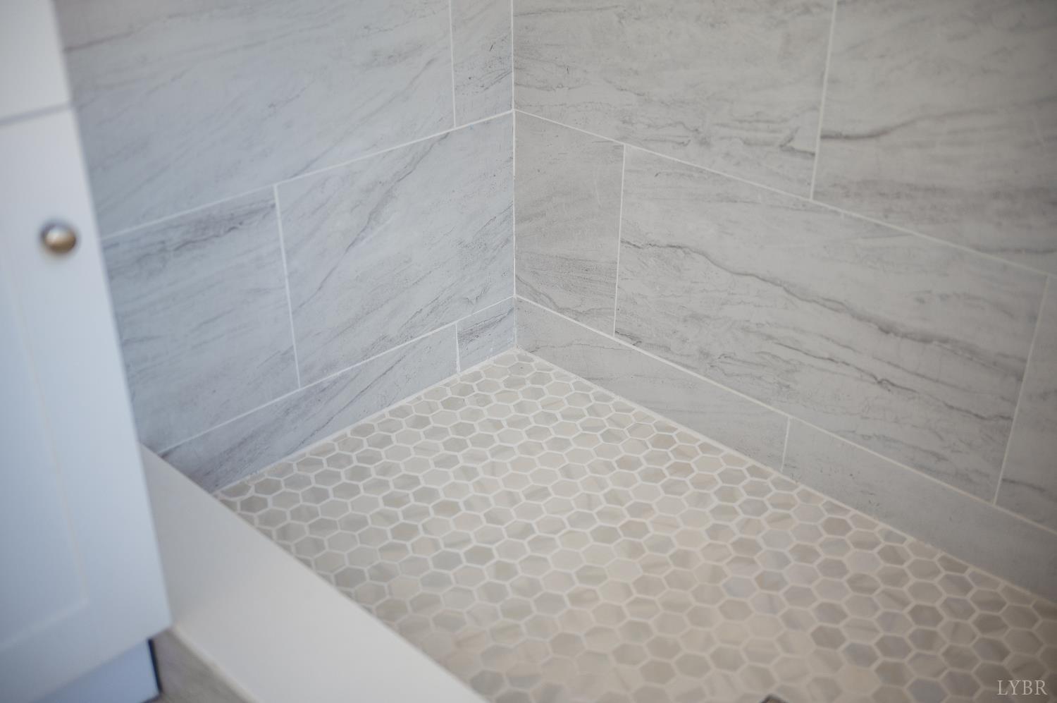 2927 Langhorne Road Lynchburg, VA 24501 - Photo 26 of 48 a bathroom with a granite countertop white and white shower