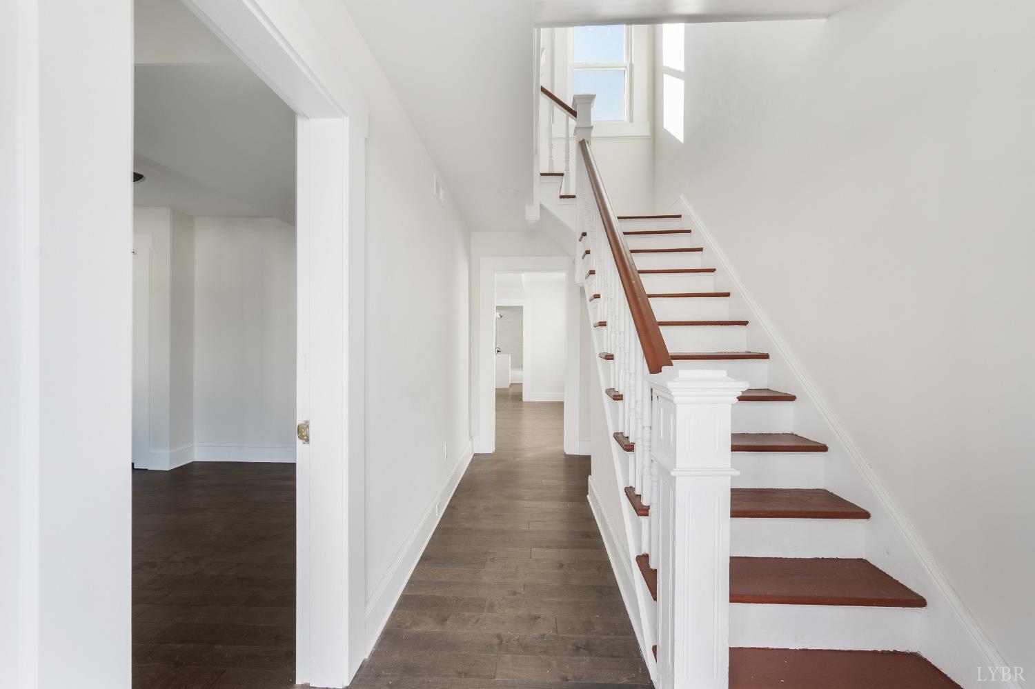 2927 Langhorne Road Lynchburg, VA 24501 - Photo 4 of 48 a view of a hallway with staircase and white walls