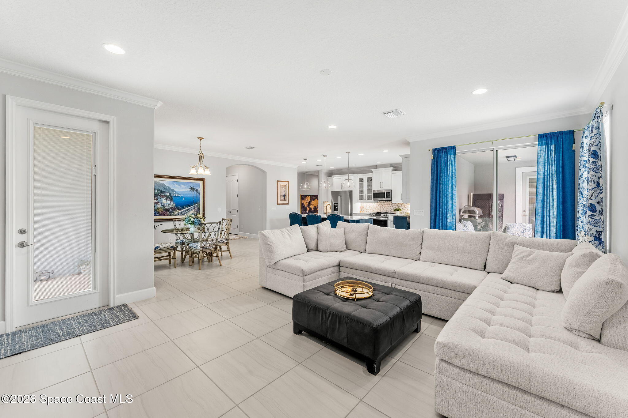 3135 Addison Drive Melbourne, FL 32940 - Photo 13 of 51 a living room with furniture and a dining table with kitchen view