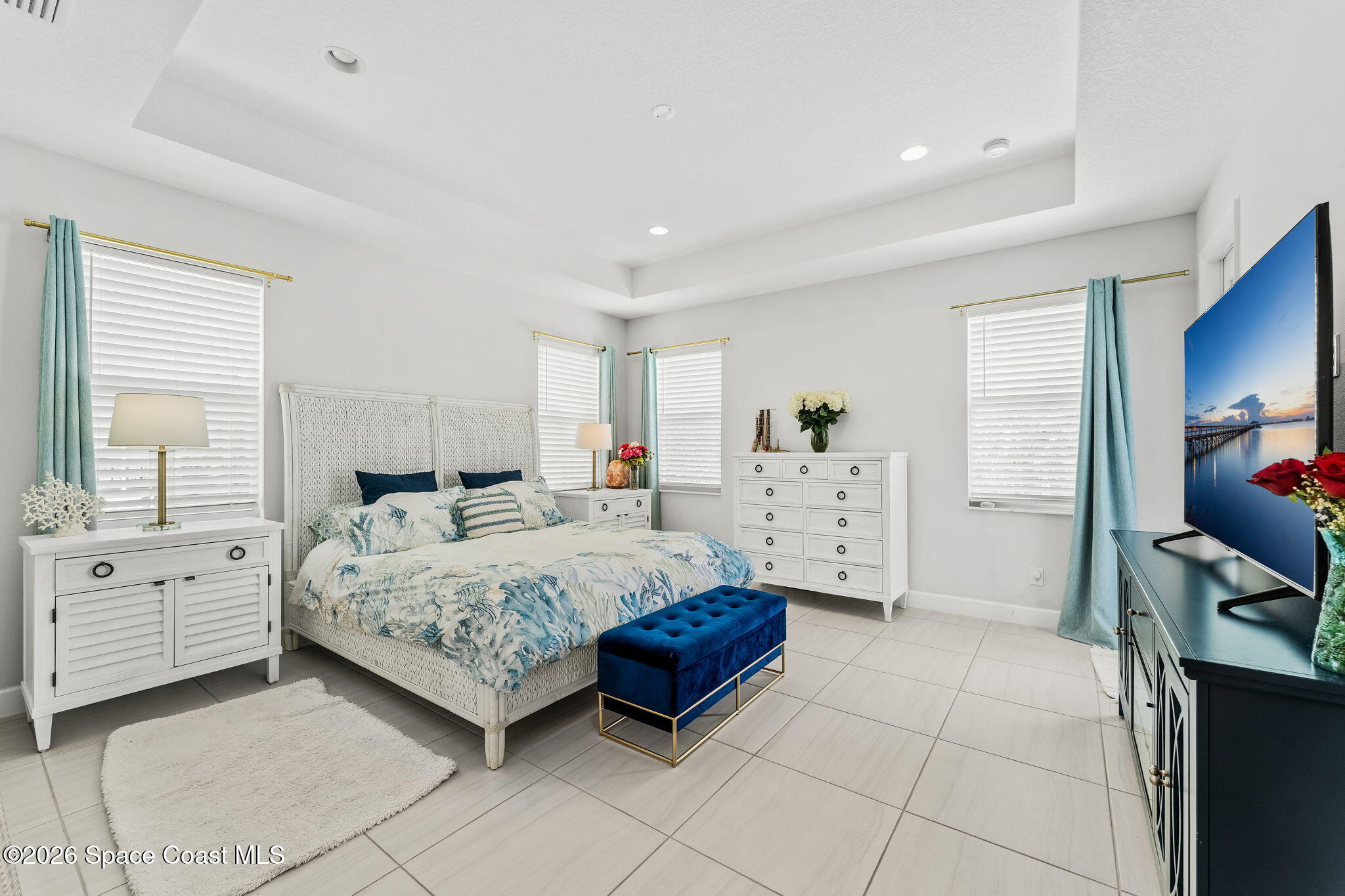 3135 Addison Drive Melbourne, FL 32940 - Photo 16 of 51 a spacious bedroom with a bed and a window