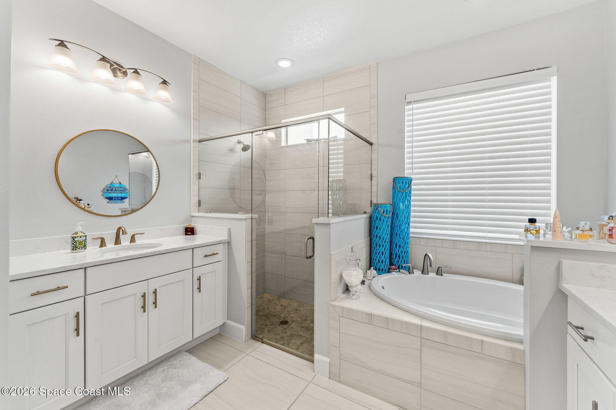 3135 Addison Drive Melbourne, FL 32940 - Photo 17 of 51 a bathroom with a double vanity sink mirror and toilet