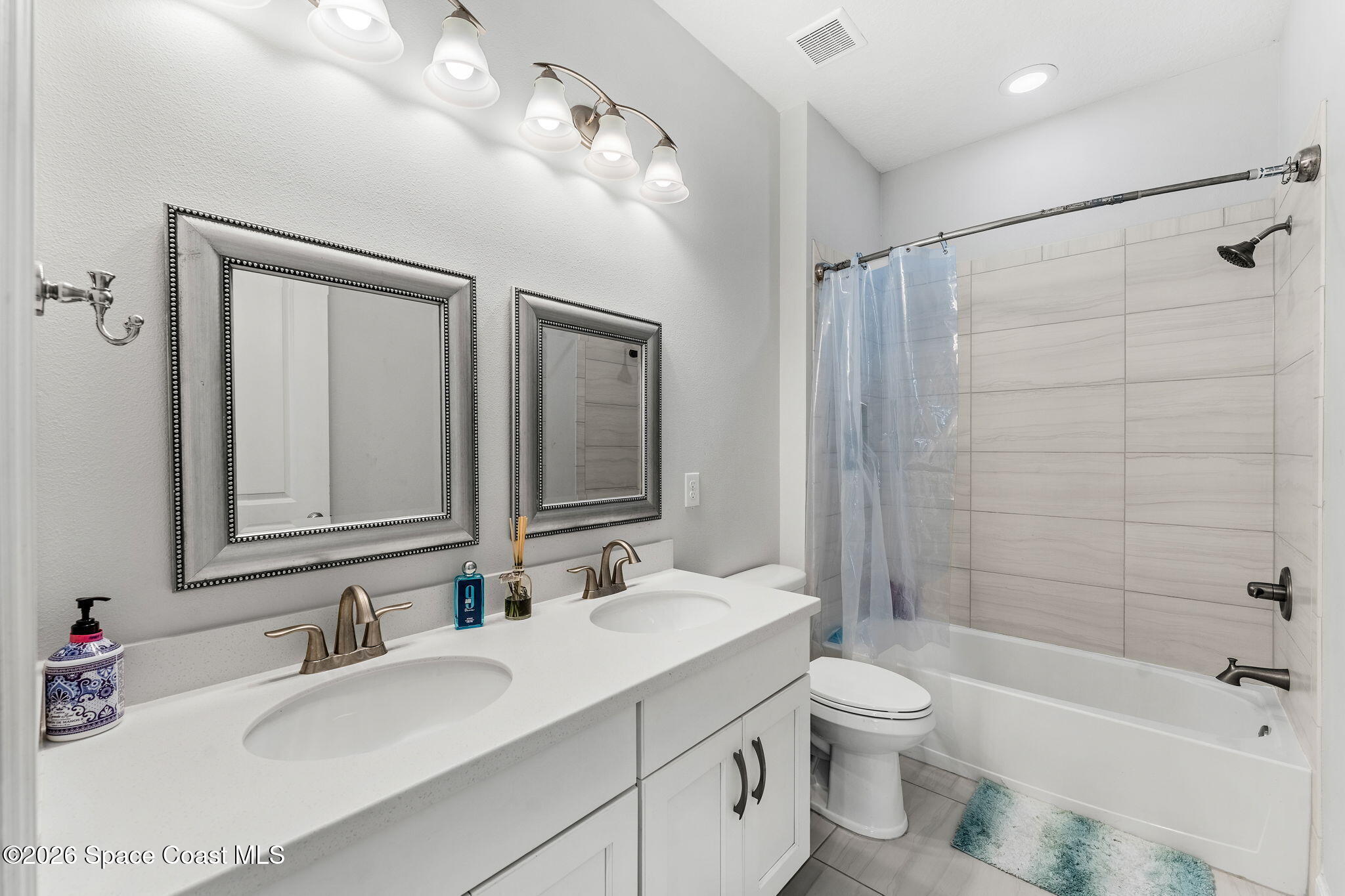 3135 Addison Drive Melbourne, FL 32940 - Photo 20 of 51 a bathroom with a sink a toilet and shower