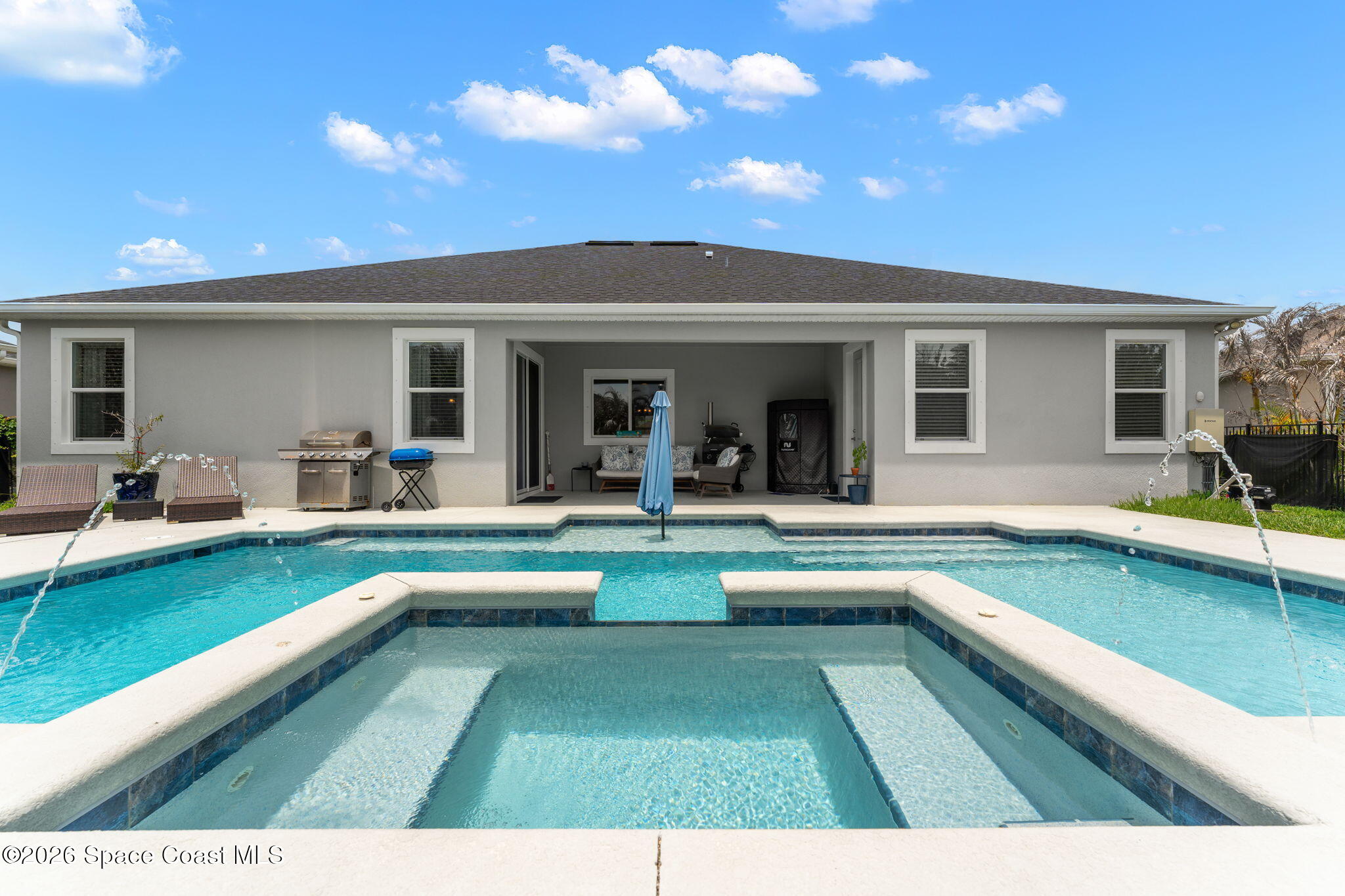 3135 Addison Drive Melbourne, FL 32940 - Photo 2 of 51 a view of a house with swimming pool and sitting area