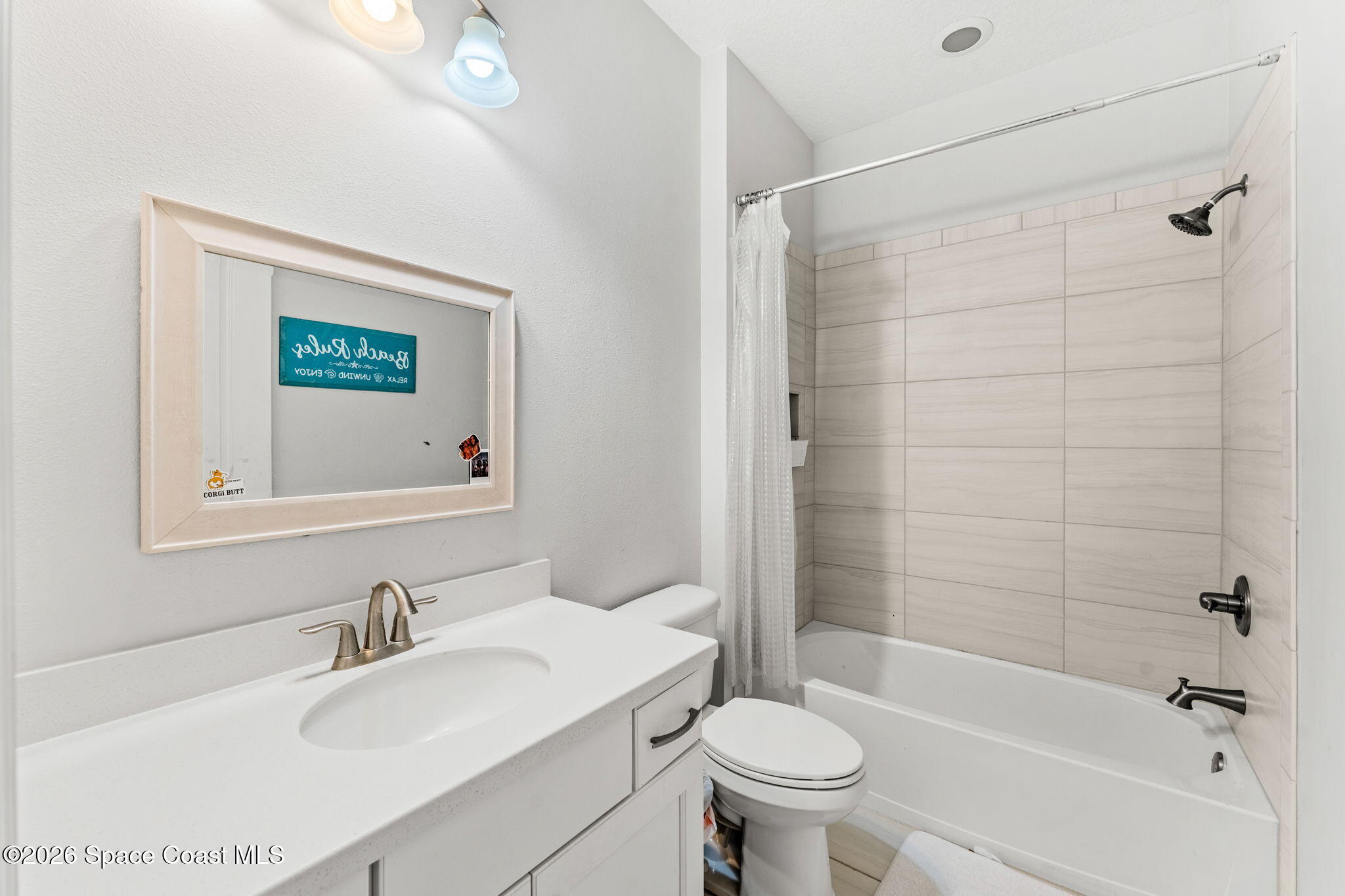 3135 Addison Drive Melbourne, FL 32940 - Photo 23 of 51 a bathroom with a sink toilet and shower