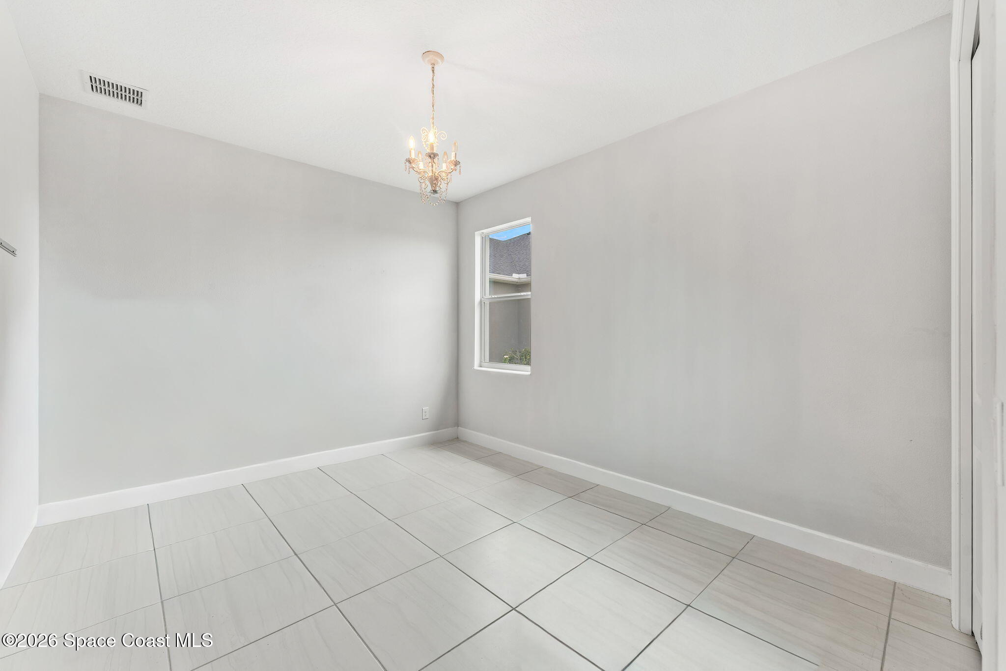 3135 Addison Drive Melbourne, FL 32940 - Photo 24 of 51 a view of an empty room with a window
