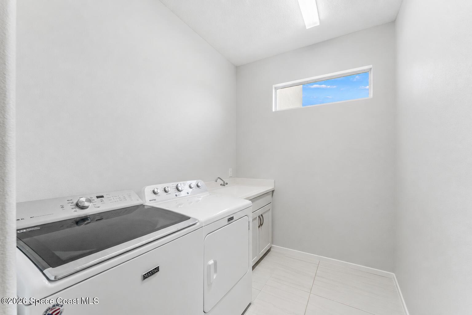 3135 Addison Drive Melbourne, FL 32940 - Photo 25 of 51 a utility room with dryer and washer