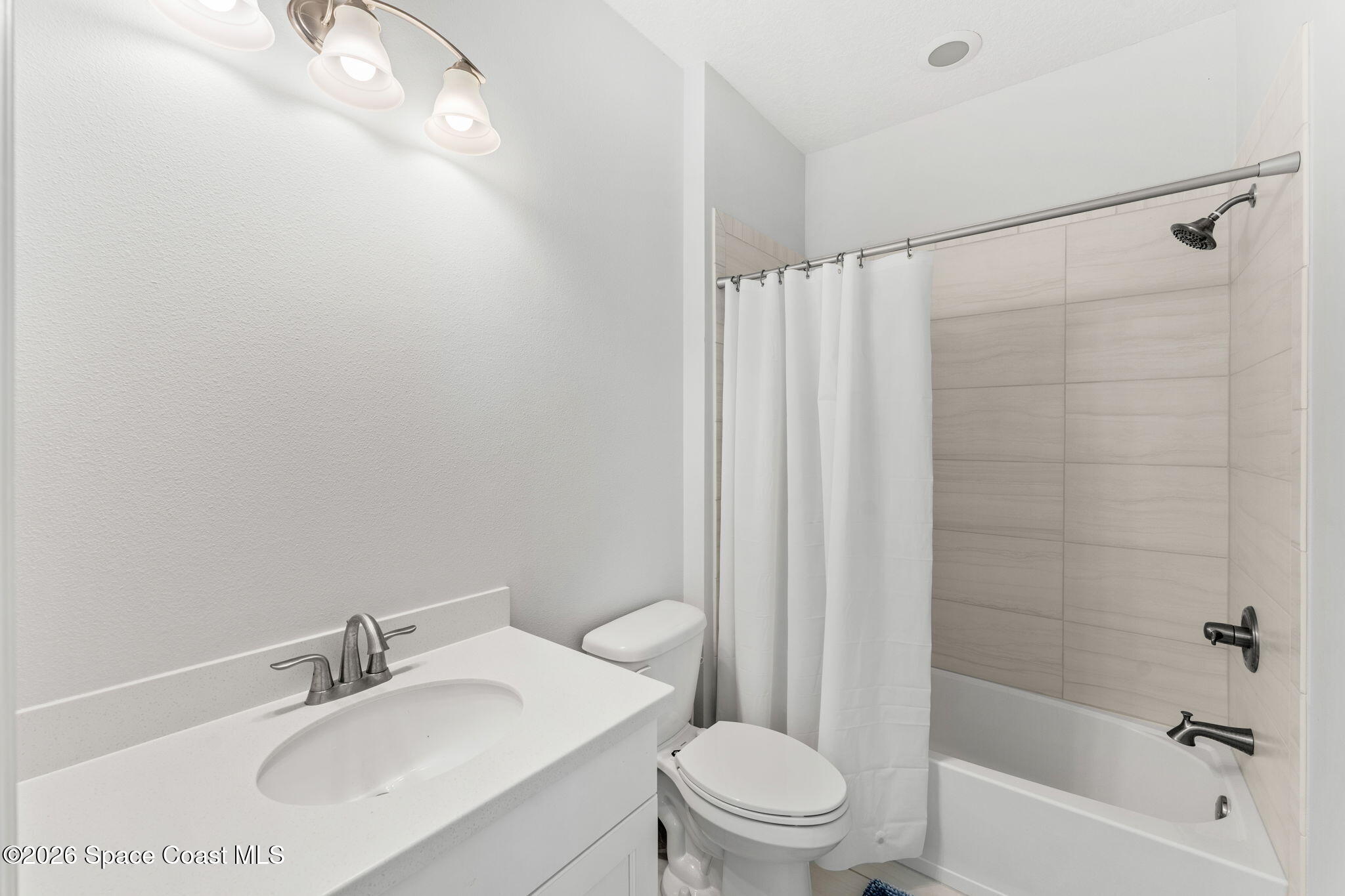 3135 Addison Drive Melbourne, FL 32940 - Photo 28 of 51 a bathroom with a sink toilet and shower