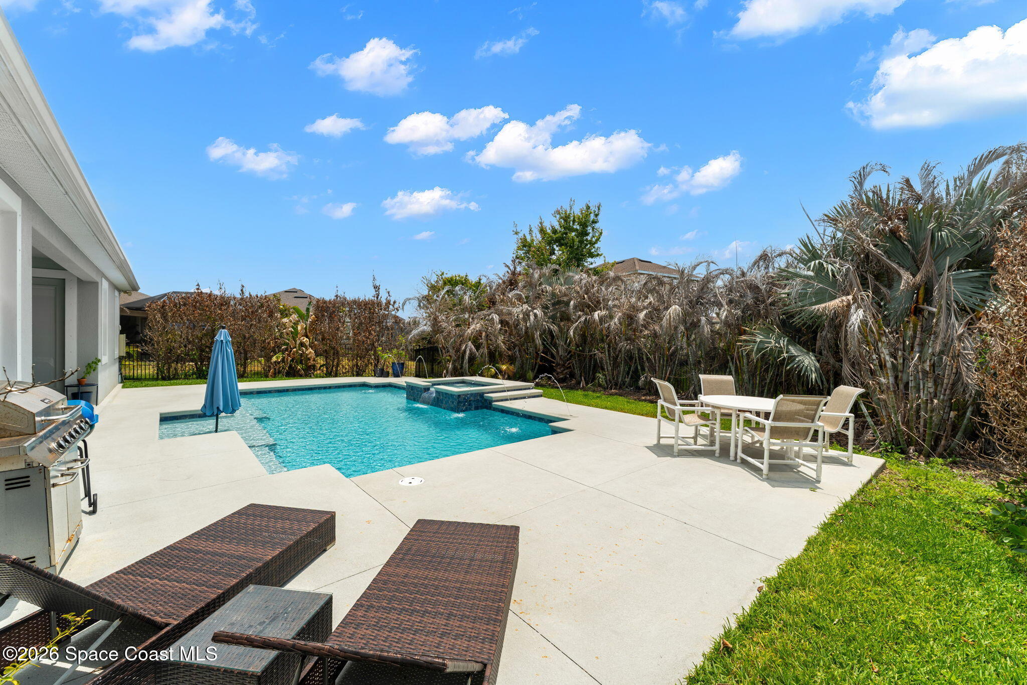 3135 Addison Drive Melbourne, FL 32940 - Photo 30 of 51 a view of a patio with swimming pool