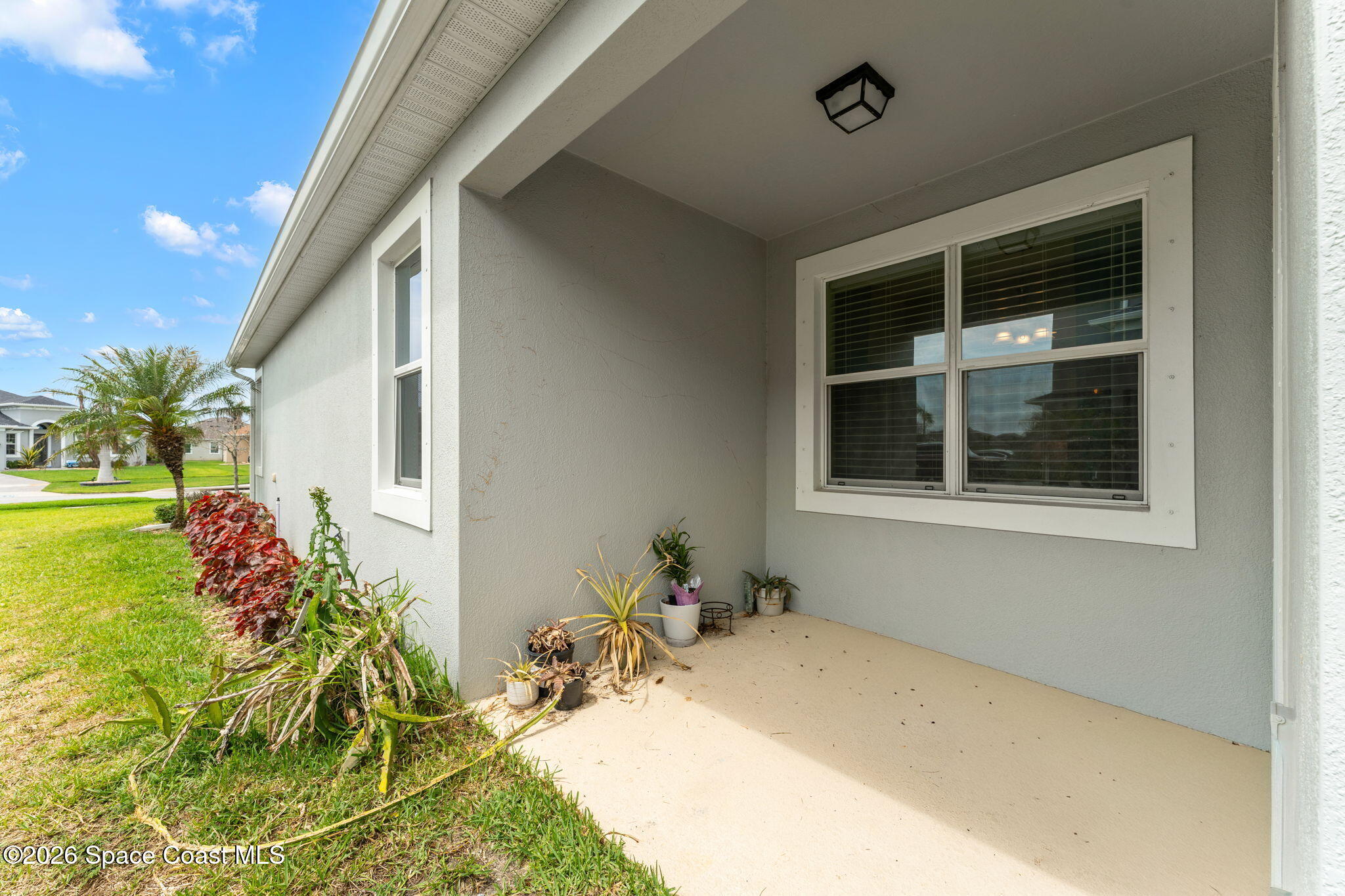 3135 Addison Drive Melbourne, FL 32940 - Photo 33 of 51 a bath room with a yard and potted plants