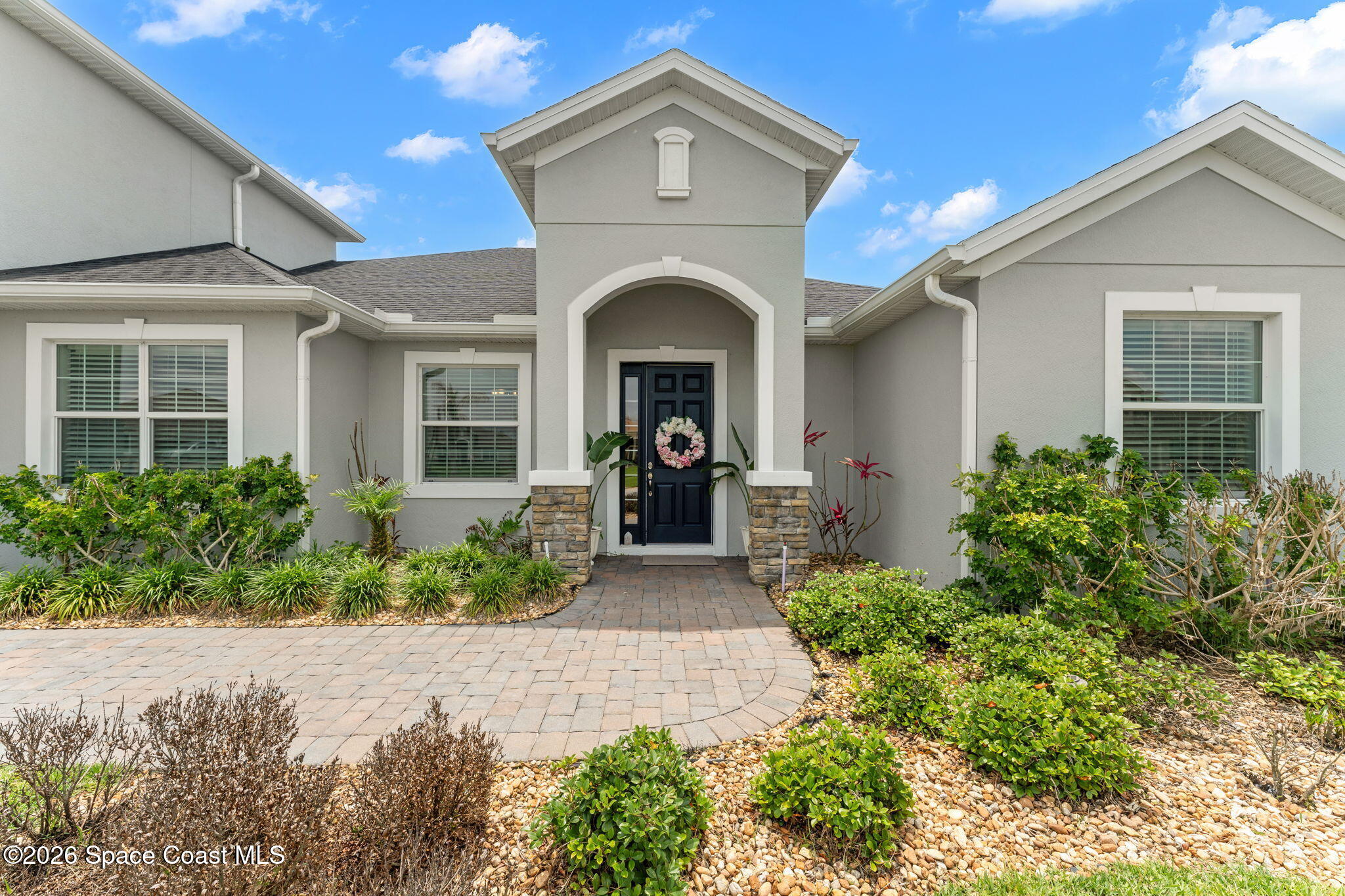 3135 Addison Drive Melbourne, FL 32940 - Photo 37 of 51 a front view of a house with a yard