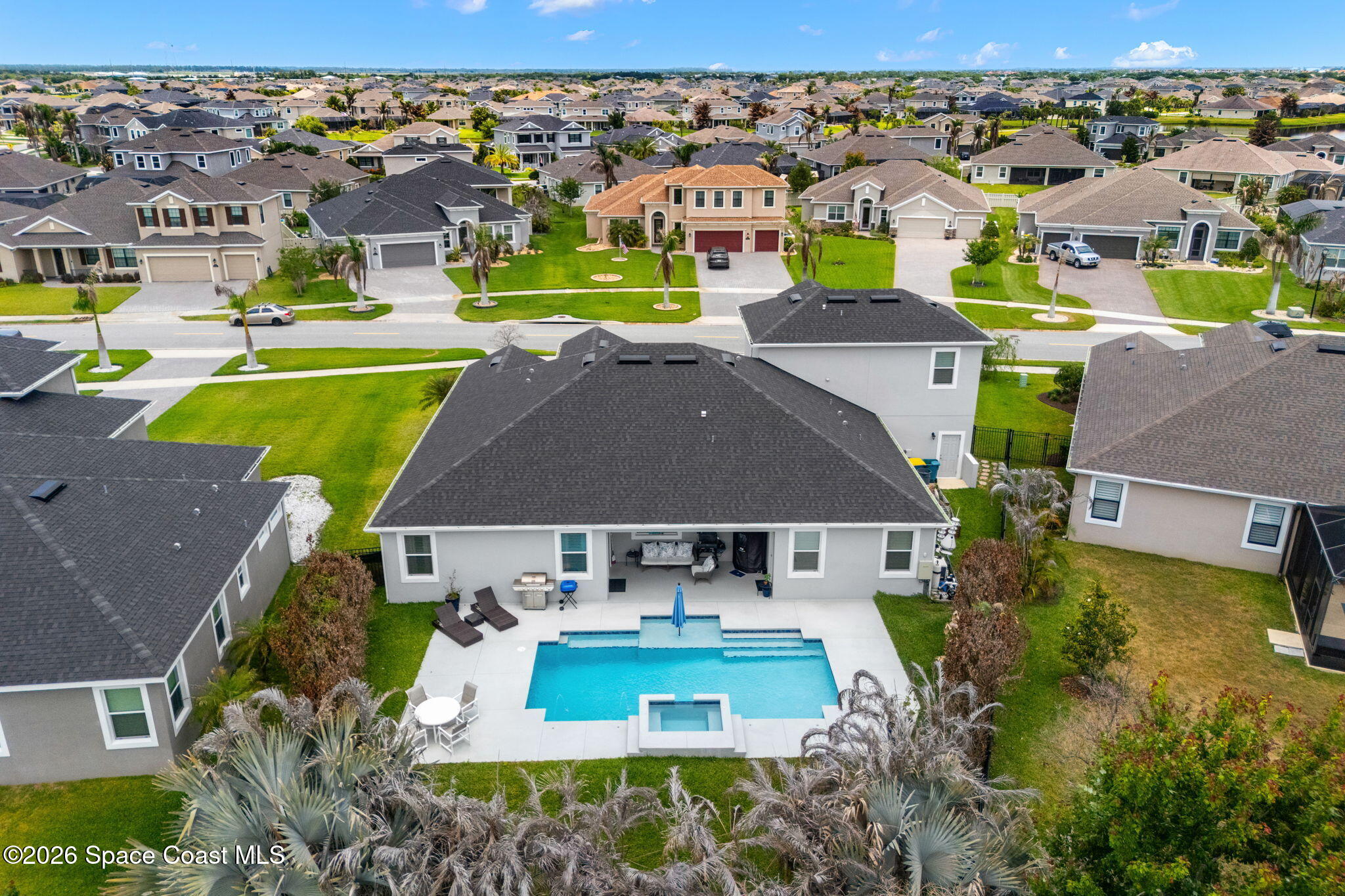 3135 Addison Drive Melbourne, FL 32940 - Photo 39 of 51 an aerial view of a house with a swimming pool yard and outdoor seating