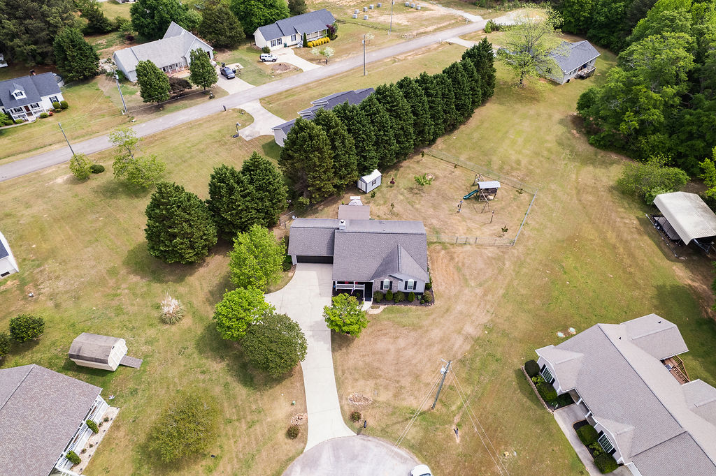 43 Graham Way Hartwell, GA 30643 - Photo 15 of 20 An aerial view showcases a residential property with surrounding greenery and neighborhood homes.