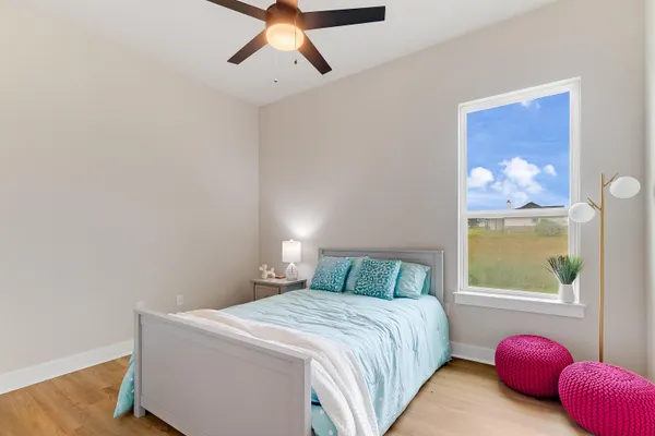 a bedroom with a bed and window