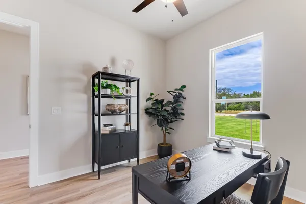 a living room with furniture and a window