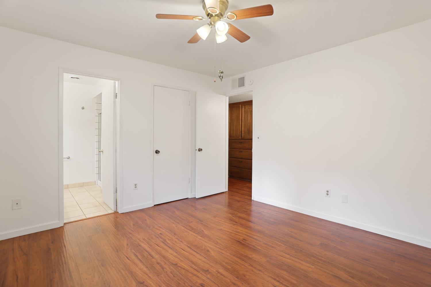 1417 Fransen Lane Modesto, CA 95355 - Photo 20 of 30 a view of an empty room with wooden floor