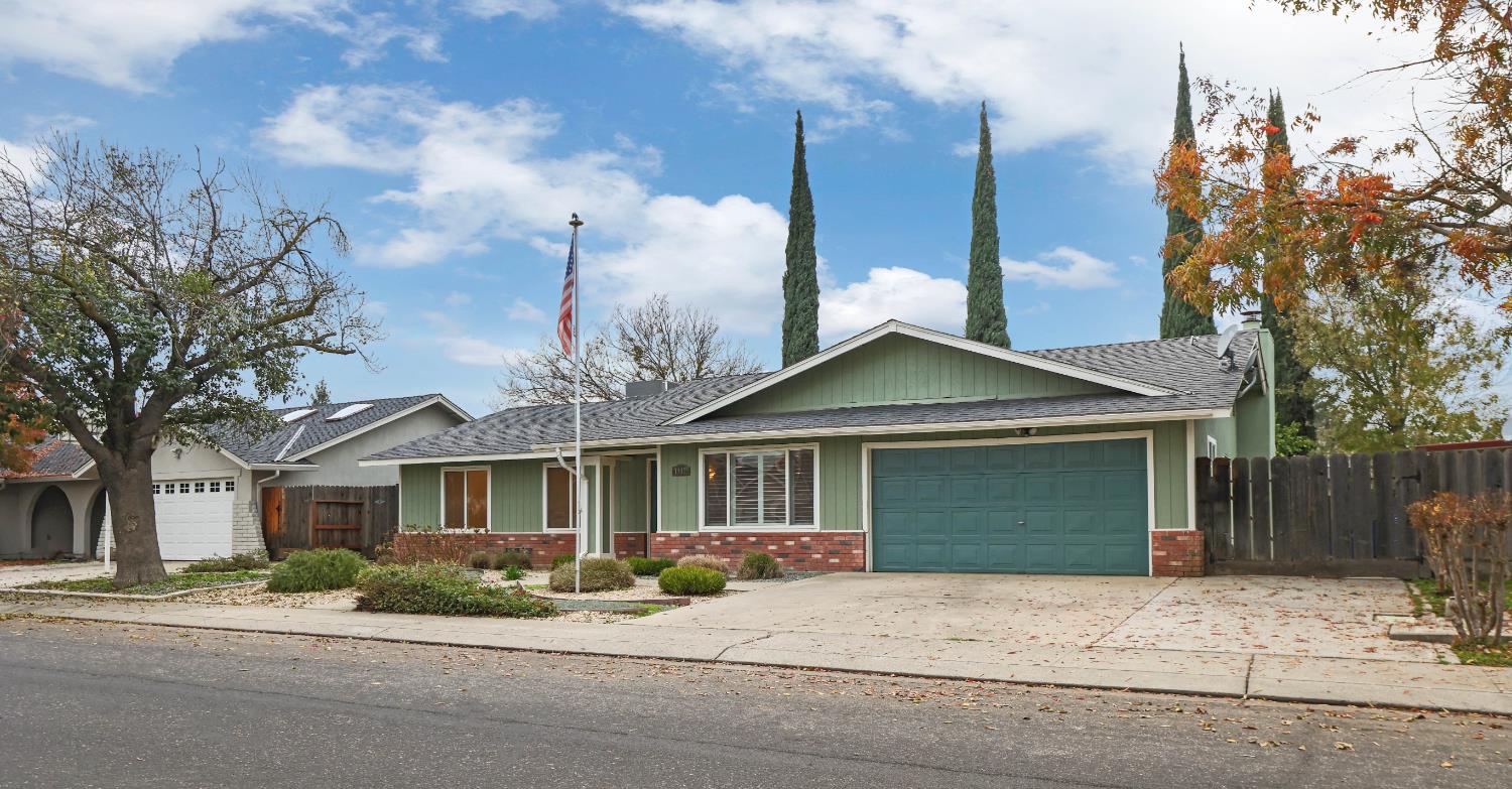 1417 Fransen Lane Modesto, CA 95355 - Photo 2 of 30 a front view of a house with a yard and garage