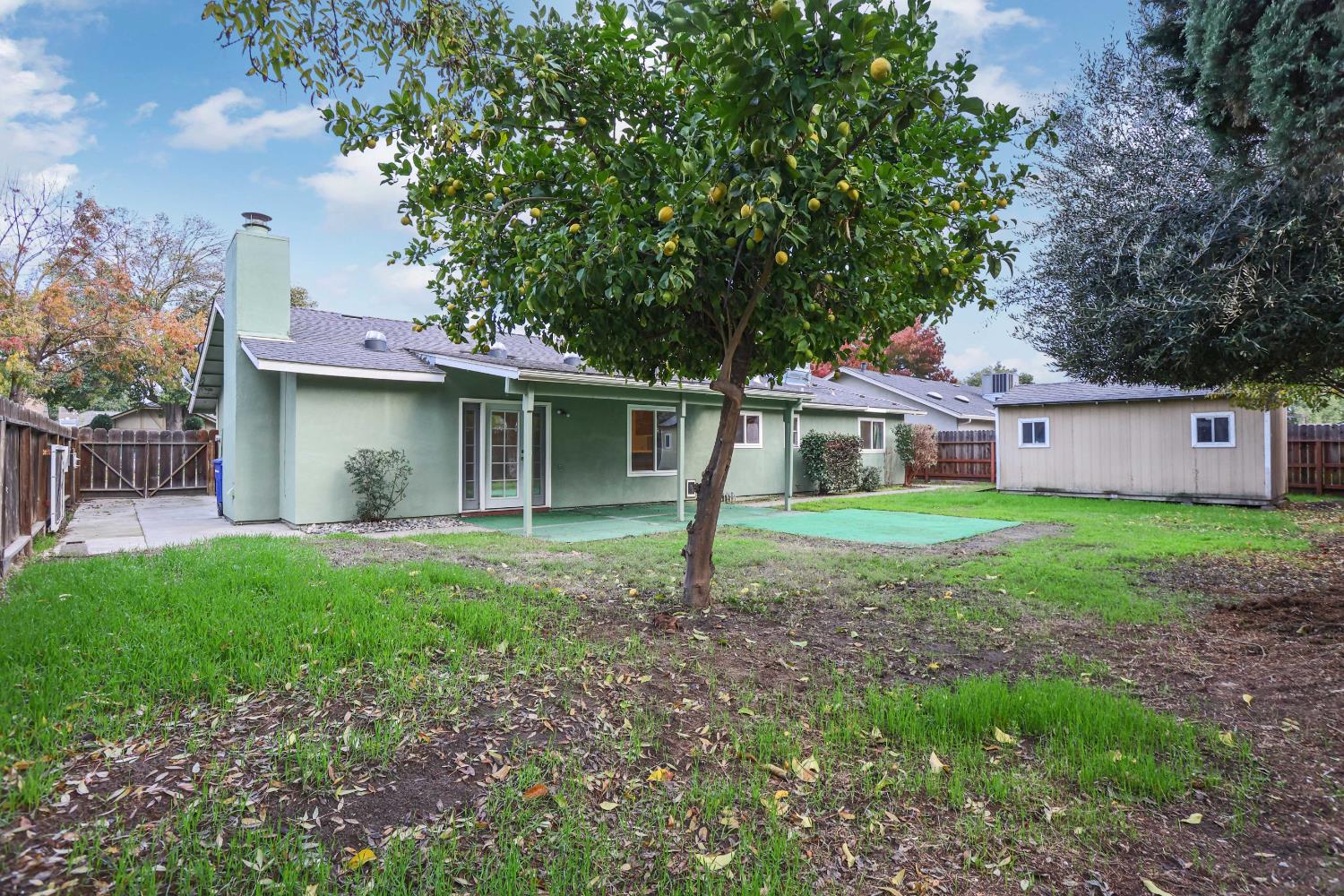 1417 Fransen Lane Modesto, CA 95355 - Photo 23 of 30 a view of a house with yard and a garden