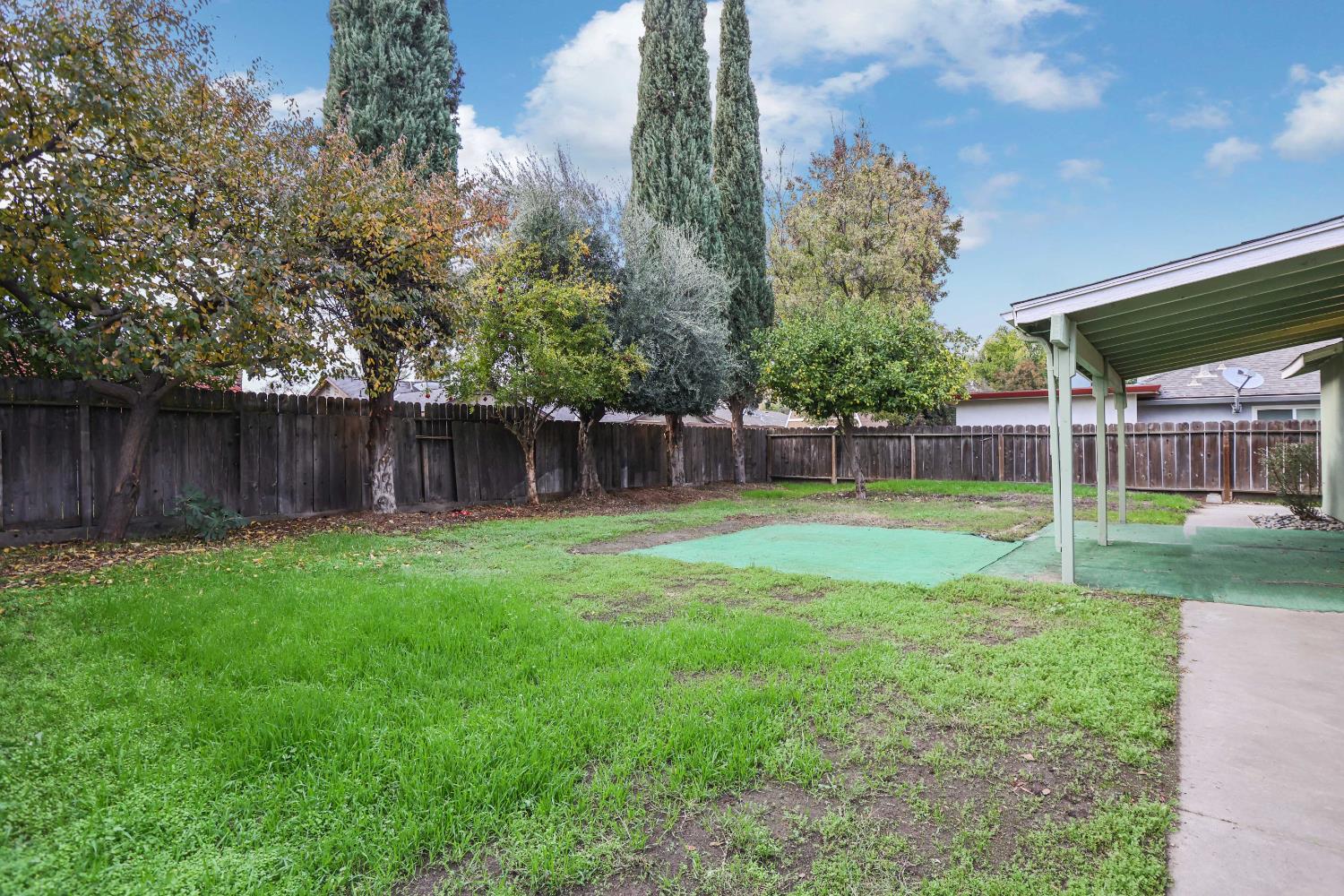 1417 Fransen Lane Modesto, CA 95355 - Photo 25 of 30 a view of a backyard with a garden and entertaining space