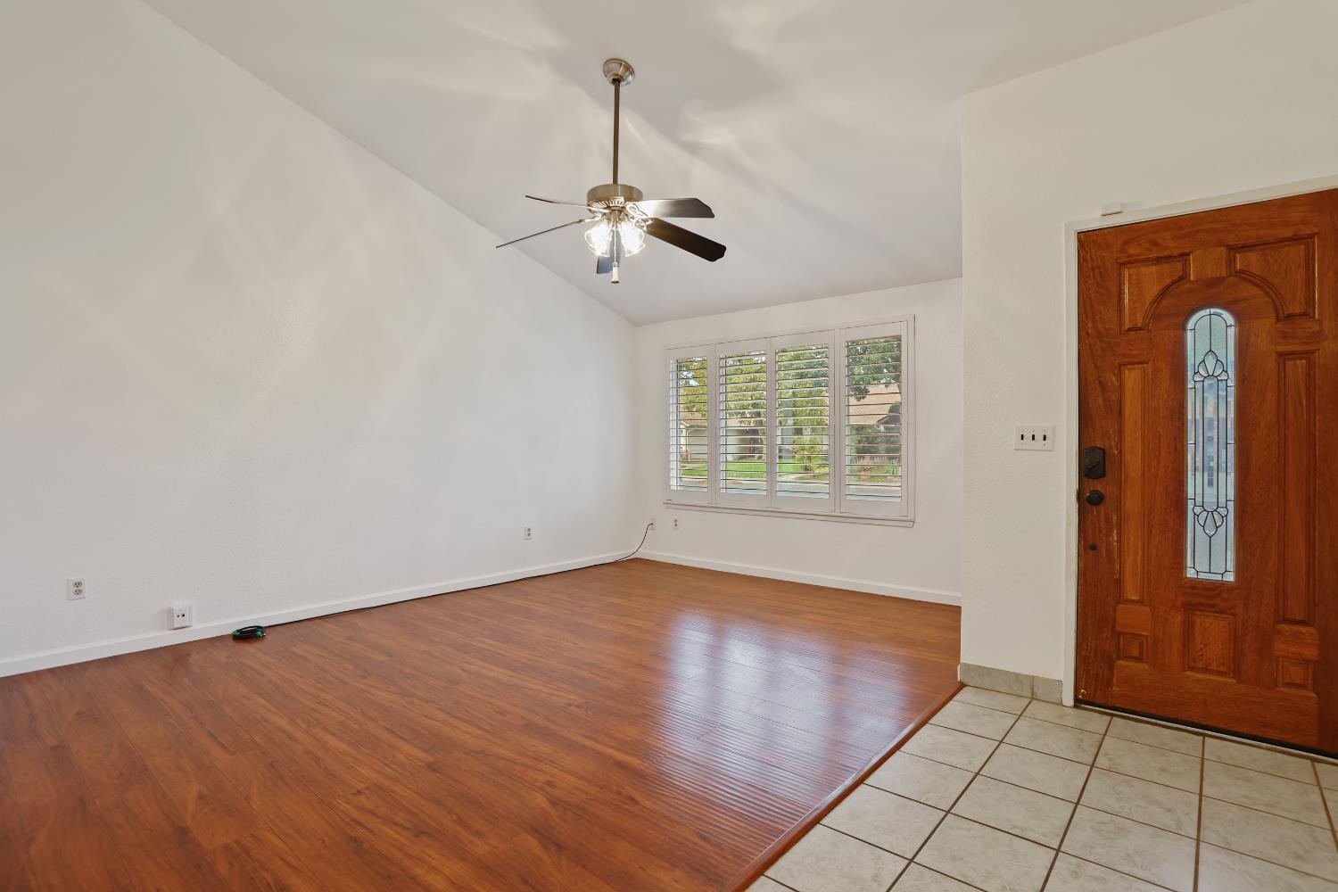 1417 Fransen Lane Modesto, CA 95355 - Photo 4 of 30 an empty room with windows and fan