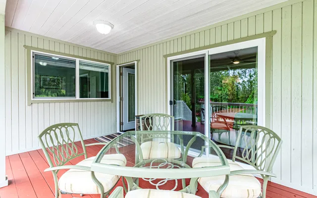 a view of a chair and table in the balcony