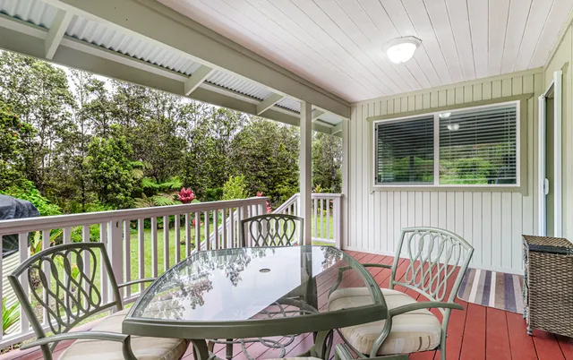 a bedroom with a bed and a table