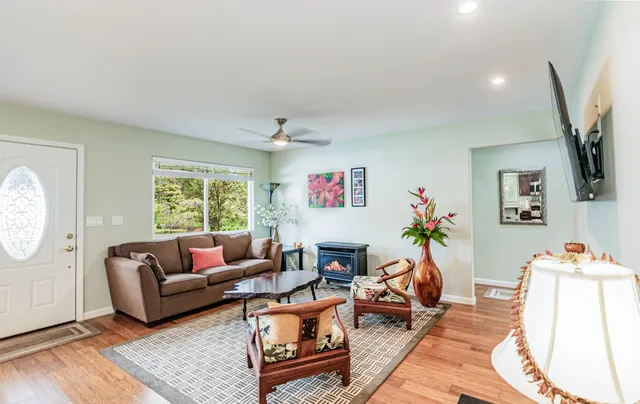 a living room with furniture and a flat screen tv