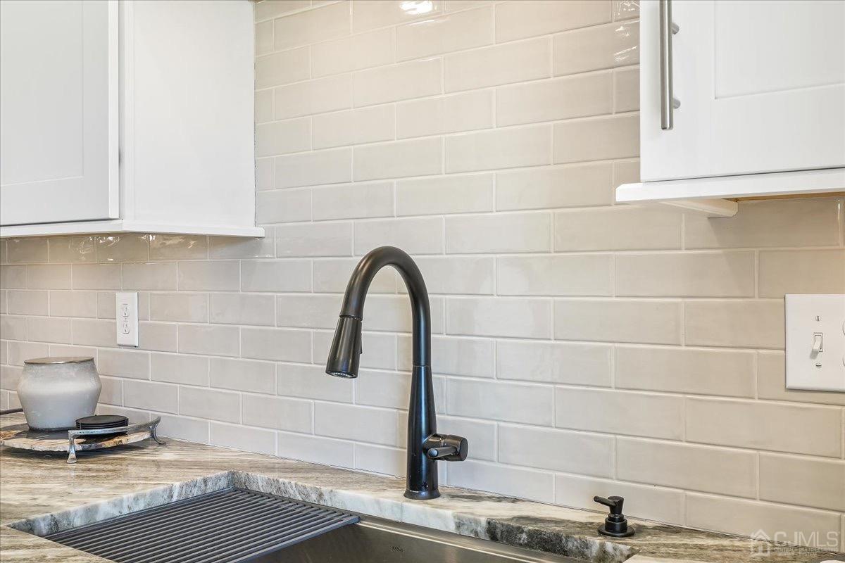 1404 Tavern Road Monroe Township, NJ 08831 - Photo 15 of 29 a bathroom with a sink and a mirror