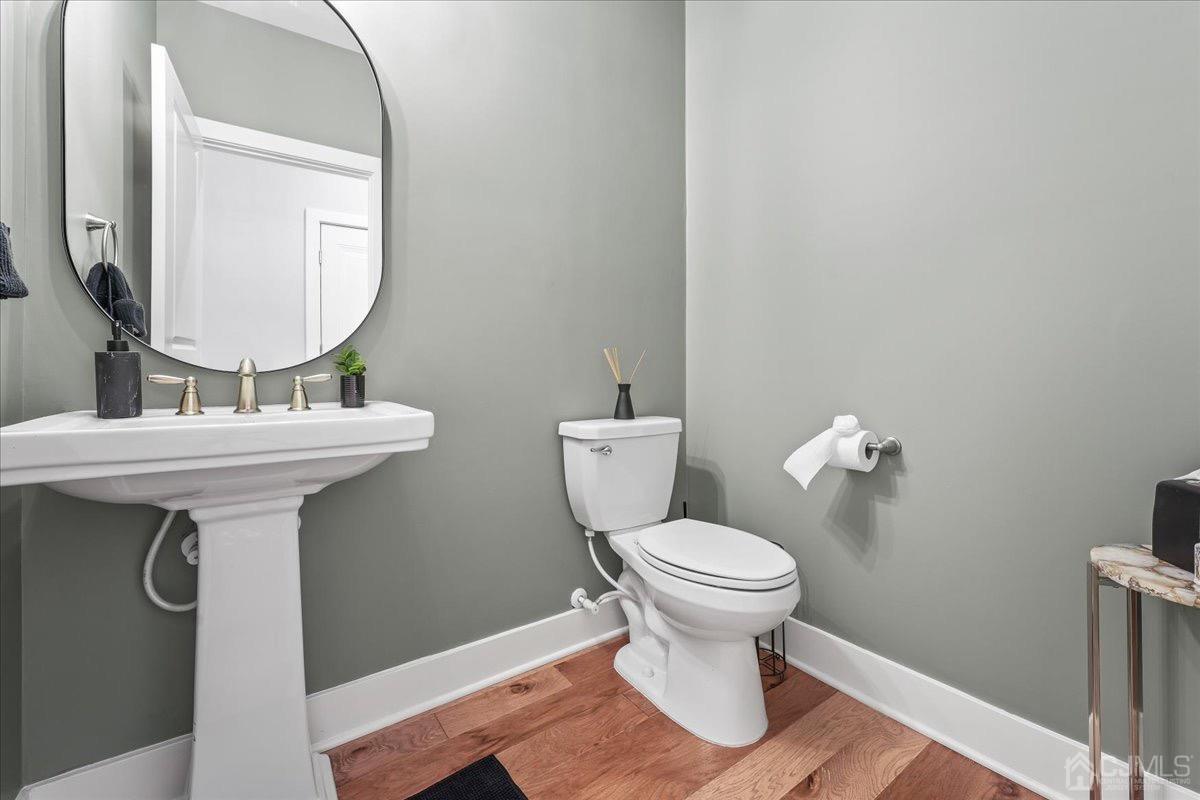 1404 Tavern Road Monroe Township, NJ 08831 - Photo 17 of 29 a bathroom with a sink toilet and a mirror