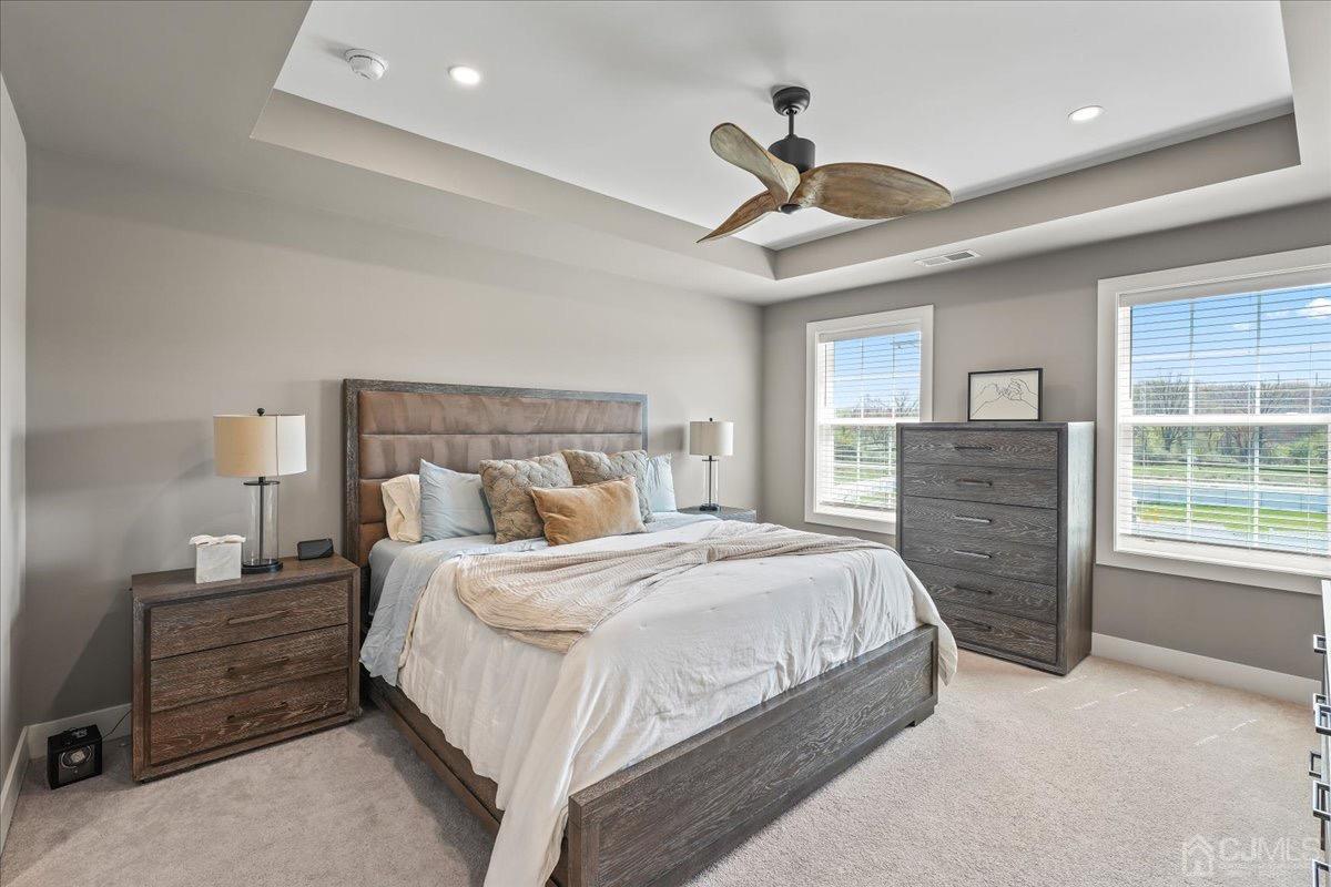 1404 Tavern Road Monroe Township, NJ 08831 - Photo 19 of 29 a bedroom with a large bed and a tv