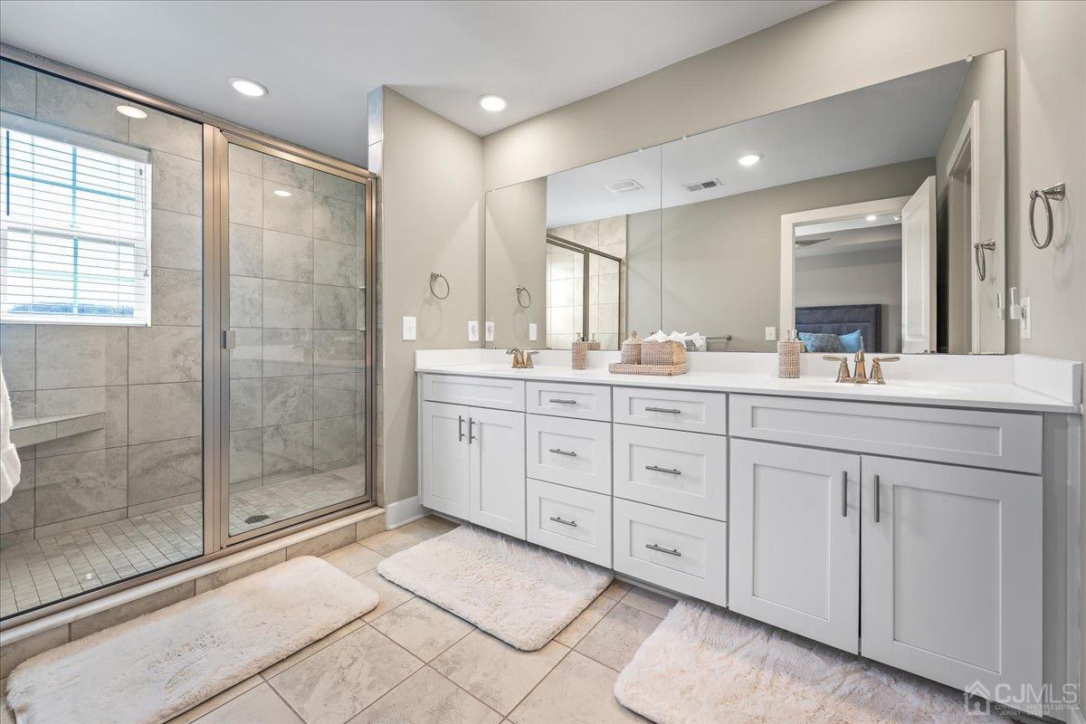 1404 Tavern Road Monroe Township, NJ 08831 - Photo 20 of 29 a bathroom with a double vanity sink mirror and shower