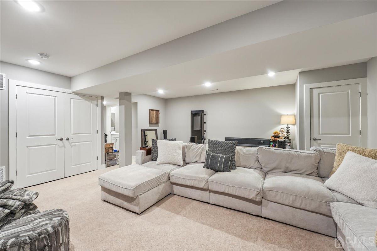 1404 Tavern Road Monroe Township, NJ 08831 - Photo 26 of 29 a living room with furniture white walls and white walls
