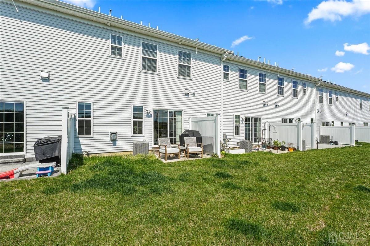 1404 Tavern Road Monroe Township, NJ 08831 - Photo 28 of 29 a view of a house with backyard and sitting area