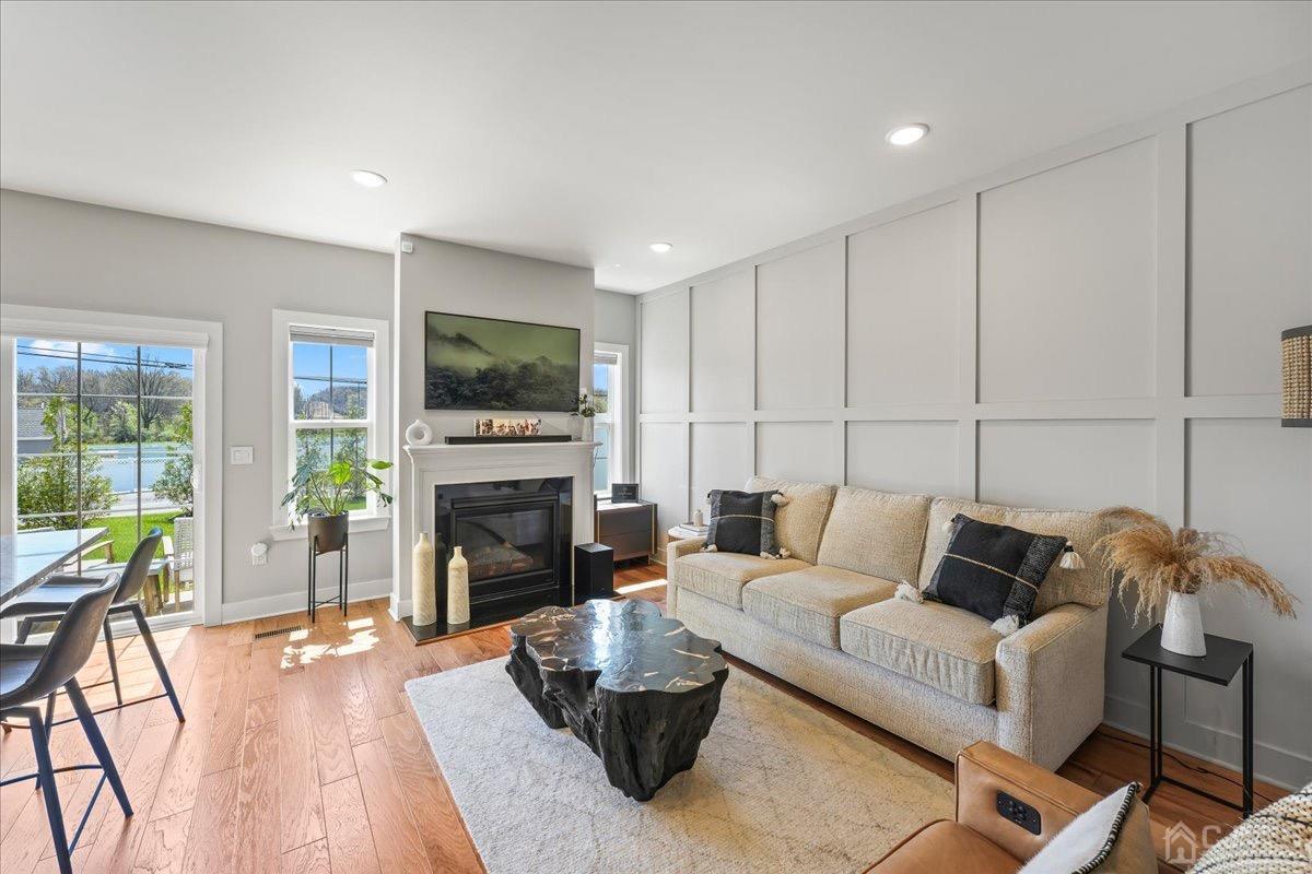 1404 Tavern Road Monroe Township, NJ 08831 - Photo 8 of 29 a living room with furniture fireplace and flat screen tv
