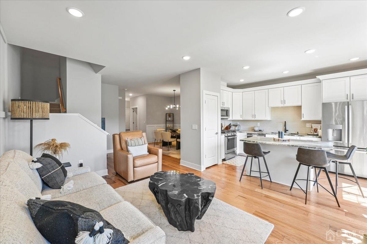 1404 Tavern Road Monroe Township, NJ 08831 - Photo 10 of 29 a living room with furniture and view of kitchen
