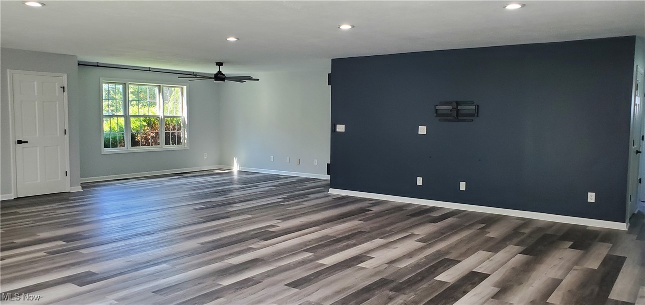 9415 Stone Road Litchfield, OH 44253 - Photo 5 of 28 Unfurnished living room featuring recessed lighting, laminate flooring, and a ceiling fan