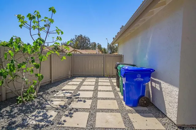 a view of a pathway with a potted plants