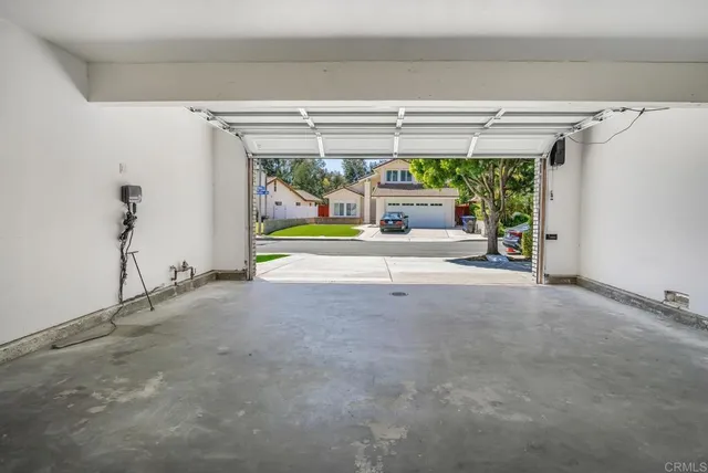a view of a room with a large window and a table