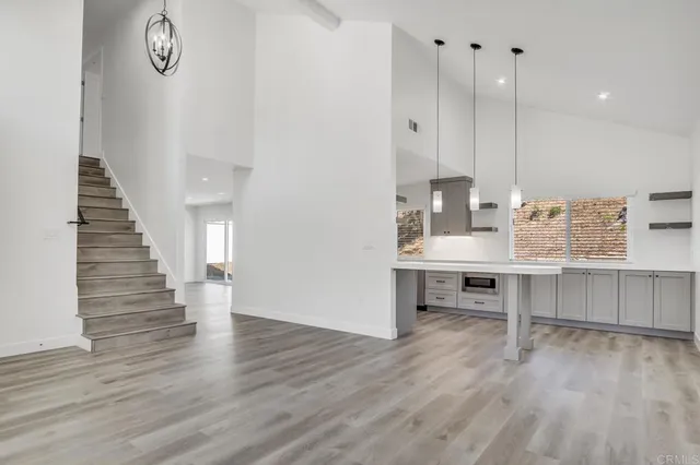 a view of kitchen and wooden floor