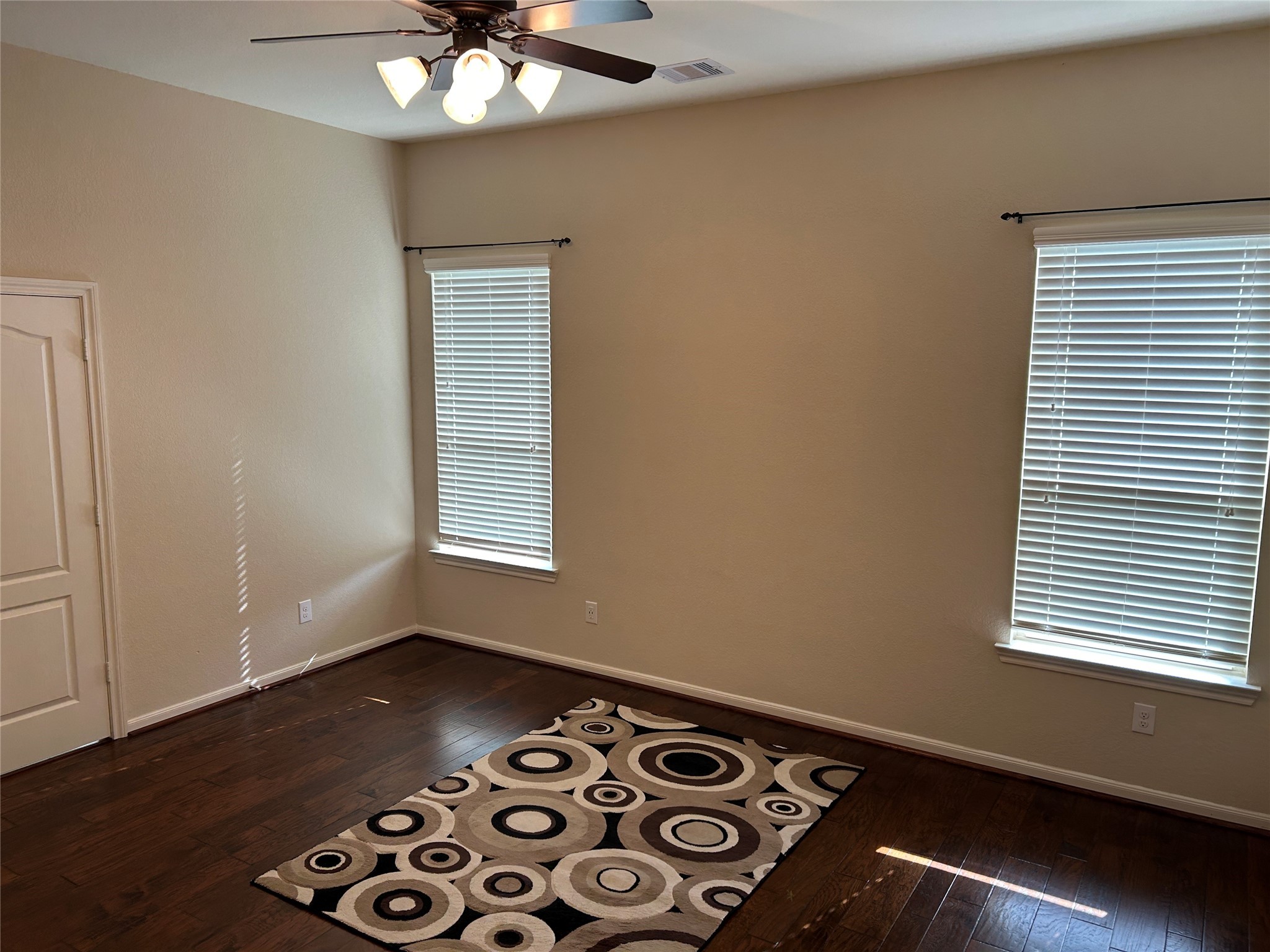 6819 Hunters Trace Lane Baytown, TX 77521 - Photo 16 of 32 a view of a room with window and wooden floor