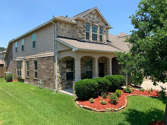 front view of a house with a yard