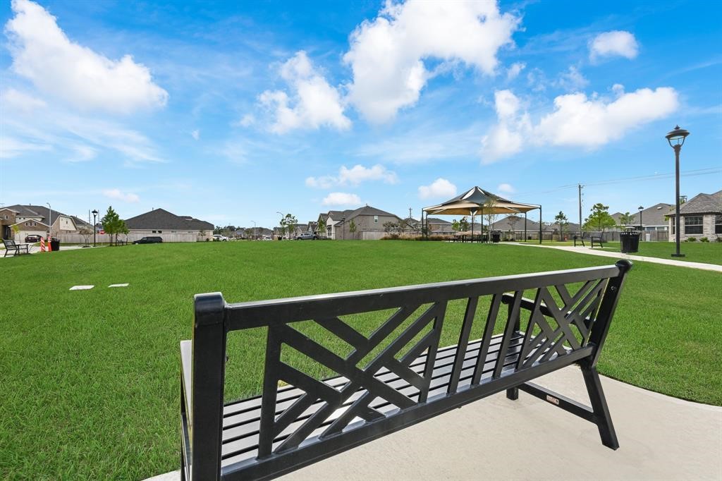 6819 Hunters Trace Lane Baytown, TX 77521 - Photo 32 of 32 a view of a roof deck with two chairs and a table