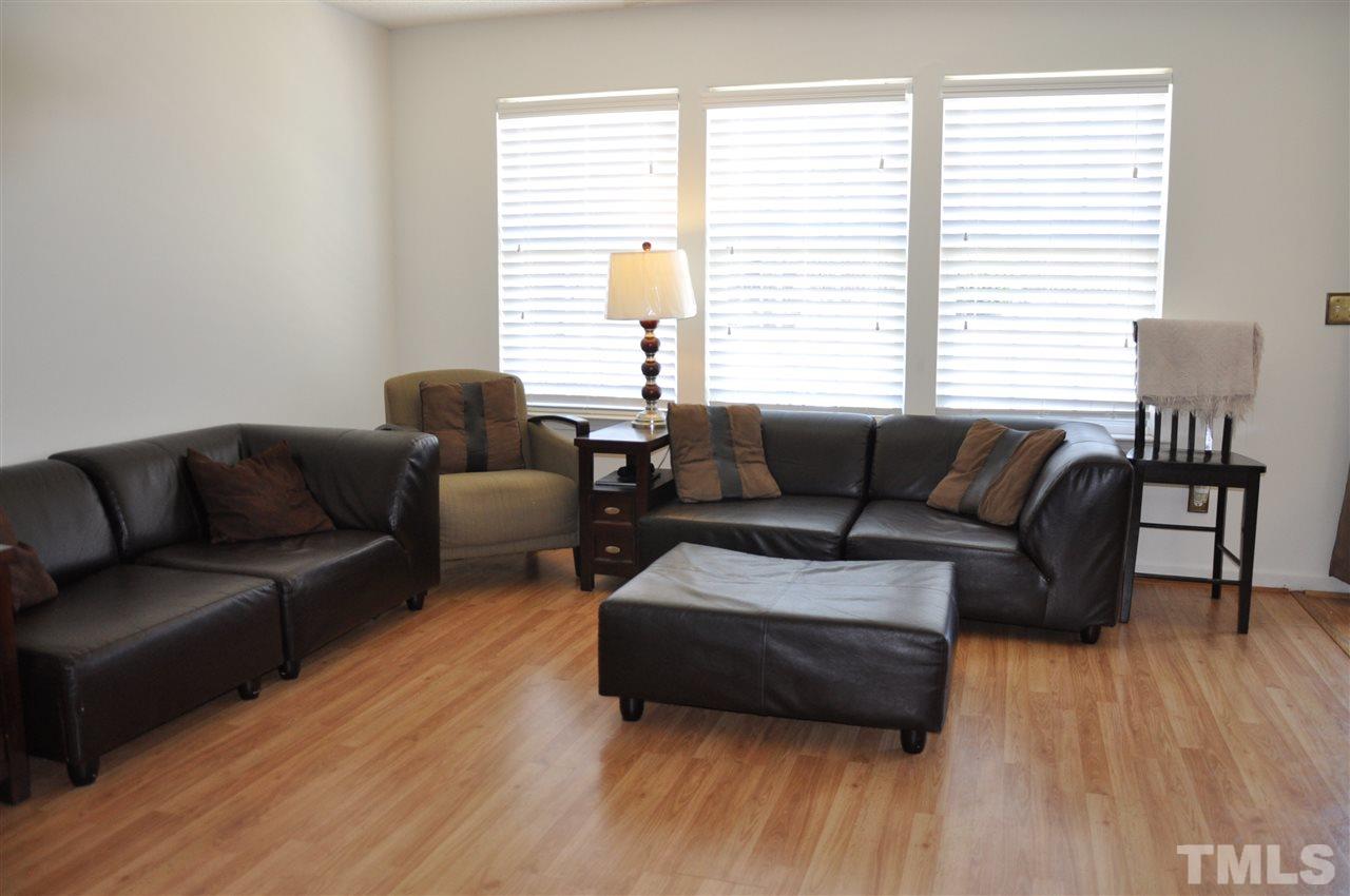 3305 Marcony Way Raleigh, NC 27610 - Photo 12 of 25 a living room with furniture and a wooden floor