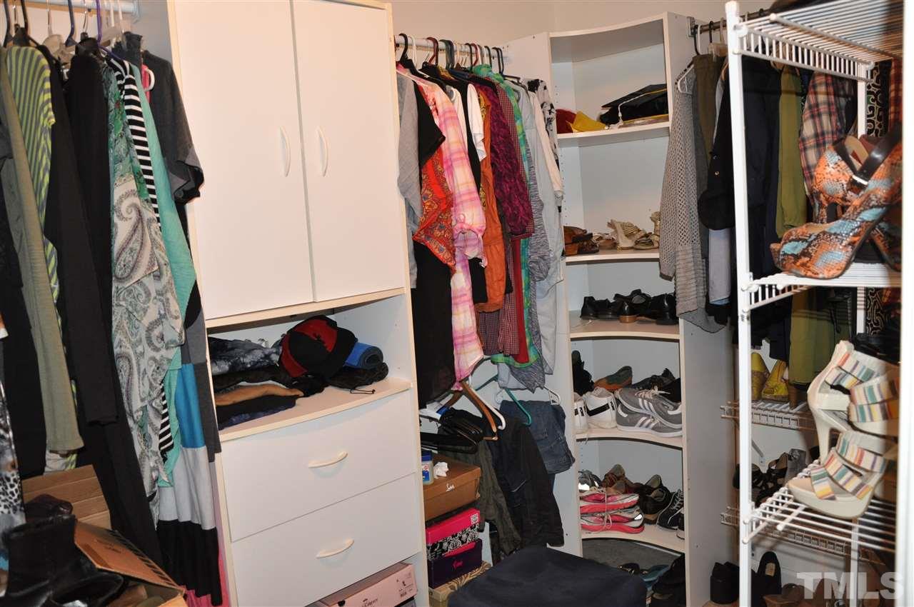 3305 Marcony Way Raleigh, NC 27610 - Photo 17 of 25 a view of walk in closet with clothes and shoes