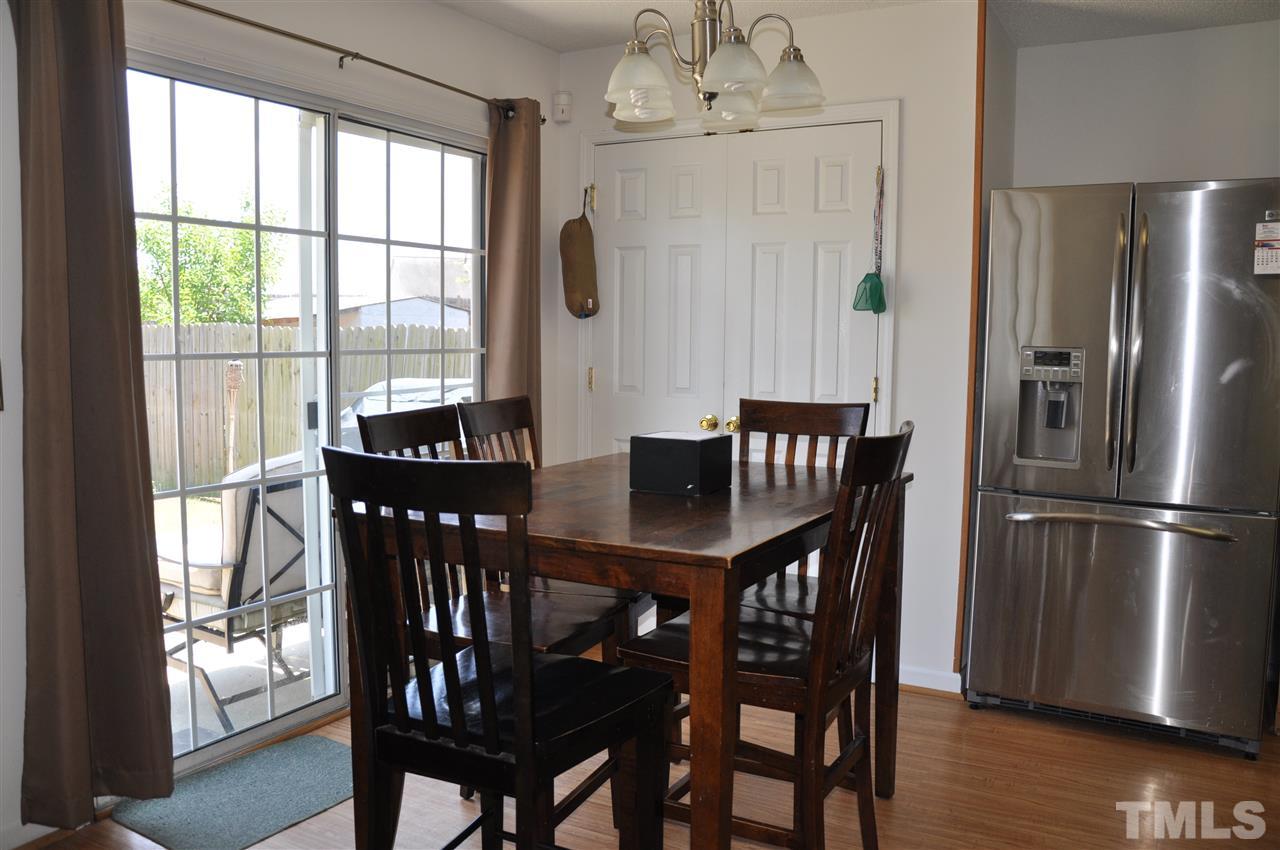 3305 Marcony Way Raleigh, NC 27610 - Photo 6 of 25 a view of a dining room with furniture window and wooden floor